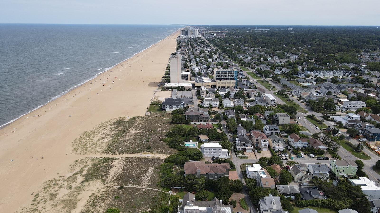 A beach with houses and trees